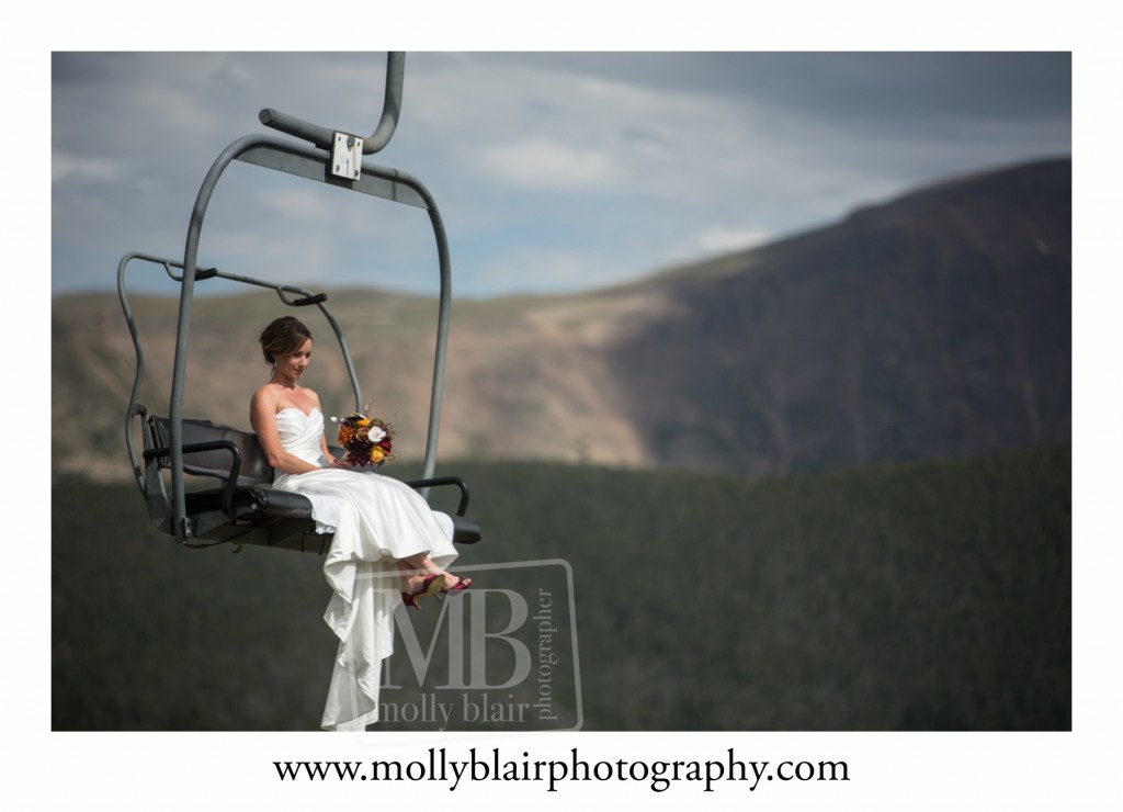 Bride arriving on a chair lift Winter Park
